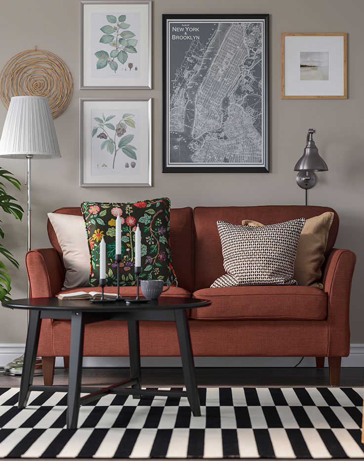 Dark furniture with a yellow cushion to create contrast.