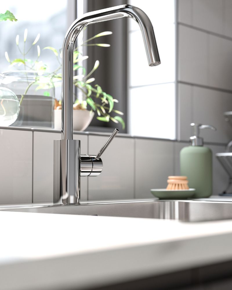 Minimal kitchen sink area with IKEA ÄLMAREN tap, JÄRSTORP countertop and LÅNGUDDEN inset sink for a clean, modern look.