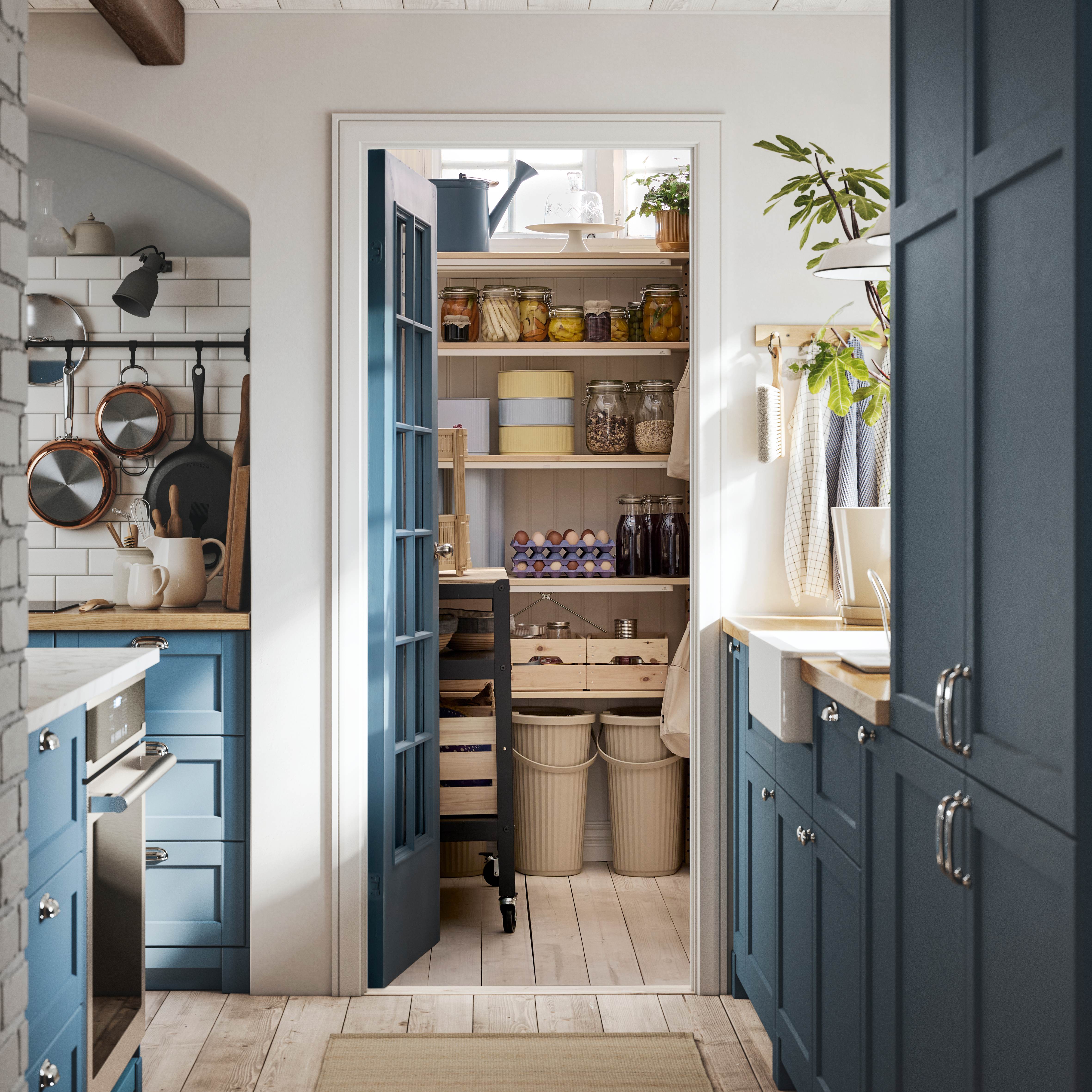 Kitchen pantry with wooden shelves filled with jars, food items, and organized containers.